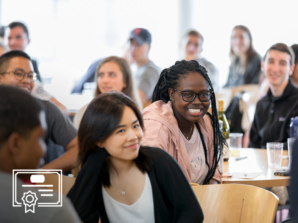 students in class; student smiling